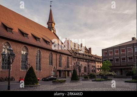 Sunset over historic old town in Nuremberg, Germany. Hospital Of The Holy Spirit. Stock Photo