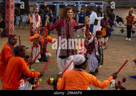A group of dancers in traditional clothing from the province of Sindh, Pakistan, performing a traditional dance Stock Photo