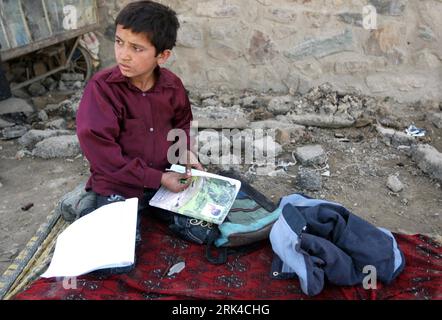 Bildnummer: 53612659  Datum: 31.10.2009  Copyright: imago/Xinhua (091120) -- KABUL, Nov. 20, 2009 (Xinhua) -- Rueid does his homework before he goes to school at his roadside workshop in Kabul, capital of Afghanistan, on Oct. 31, 2009.  (Xinhua/Zabi Tamanna) (wjd) (UNIVERSAL CHILDREN S DAY)(12)AFGHANISTAN-TRIO SIBLINGS-LIFE PUBLICATIONxNOTxINxCHN Gesellschaft Kind Kinder Fotostory Homestory kbdig xkg 2009 quer    Bildnummer 53612659 Date 31 10 2009 Copyright Imago XINHUA  Kabul Nov 20 2009 XINHUA Rueid does His homework Before he goes to School AT His Roadside Workshop in Kabul Capital of Afgh Stock Photo