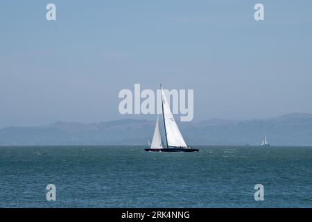 USA 76 sailing in San Francisco Bay Stock Photo