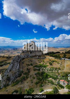 The magnificent Mussomeli Castle on a hill, overlooking the beautiful valley below. Italy. Stock Photo