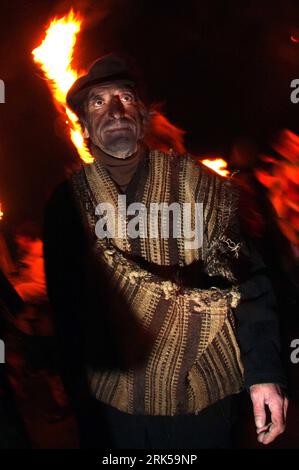 Bildnummer: 53726504  Datum: 13.01.2010  Copyright: imago/Xinhua (100114) -- GABROVDOL, Jan. 14, 2010 (Xinhua) -- A reveller takes part in the Kukeri ritual around bonfire in the village of Gabrovdol, some 30 kilometers from Sofia, Bulgaria, on Jan. 13, 2010. Kukeri is an important masked ritual in rural Bulgaria with participants wearing scary masks with the intention to scare away the evil spirits or ghosts, and welcome the upcoming spring. (Xinhua/Velko Angelov)(hdt) (1)BULGARIA-GABROVDOL-CARNIVAL-LUSTRATING DEVILS PUBLICATIONxNOTxINxCHN Reisen kbdig xmk 2010 hoch Highlight premiumd o0 Karn Stock Photo