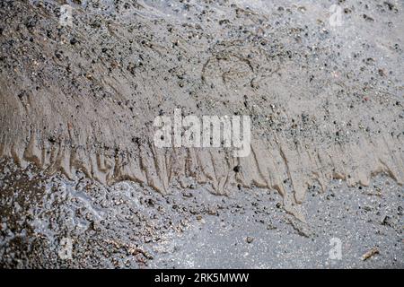 Mud, puddles, a country road after rain. Sand on the road Stock Photo