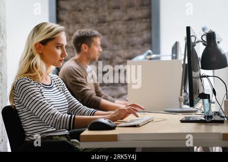 Software engineers working on project and programming in company. Business people concept. Stock Photo