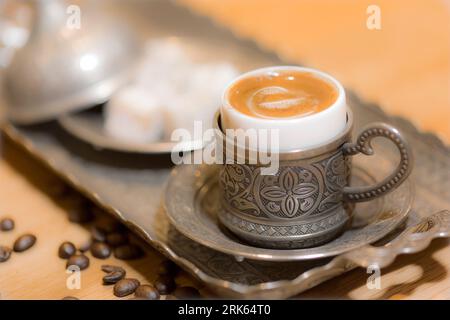 Turkish coffee. Turkish delight on dark green wooden background. Flat lay. Traditional Turkish coffee in oriental dishware close up Stock Photo