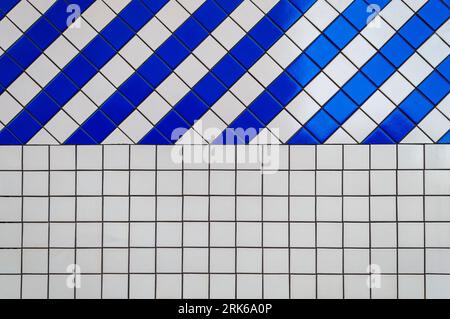 Design element. Beautiful pattern. Wall of white and blue tiles. Advertising space. Background. Horizontal. Stock Photo