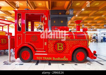 Oita, Japan - Nov 26 2022:The famous Japanese toy train, Bun Bun Go, operated inside the central hall at Oita station Stock Photo