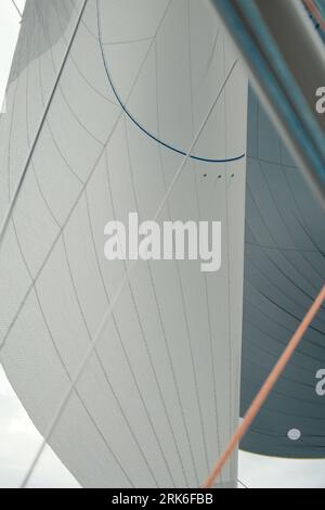 A close-up of a sailboat mast and jib Stock Photo