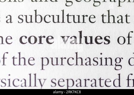 Close-up of the phrase 'Core Values' in white text on a paper background Stock Photo