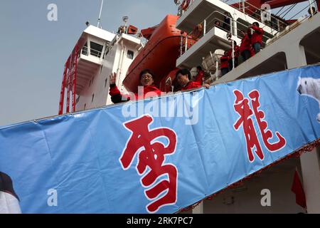 (100411) -- SHANGHAI, April 11, 2010 (Xinhua) -- The members of China s 26th Antarctic expedition team get off Xuelong (Snow Dragon) icebreaker upon its arrival at the harbour of Shanghai, east China, April 10, 2010. China s 26th Antarctic expedition team aboard the Xuelong (Snow Dragon) icebreaker return to its base in Shanghai Saturday morning after finishing 12 scientific research projects covering remote sensing, icebergs, biology, physics, etc. This expedition had the biggest staff since China started Antarctic missions in 1984. The 249 staff completed more than 50 scientific research pro Stock Photo