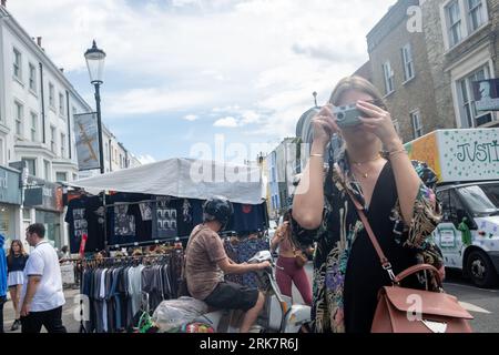 LONDON- JULY 10, 2023: Portobello Road in Notting Hill, a landmark street of shops with a famous street market Stock Photo