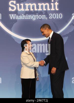 U.S. President Barack Obama (R) greets Philippine President Gloria Macapagal-Arroyo upon her arrival for a working dinner during the Nuclear Security Summit in Washington, the United States, April 12, 2010. U.S. President Barack Obama on Monday evening welcomed world leaders to a working dinner in Washington, kicking off a summit aimed at preventing terrorists from obtaining nuclear weapons. (Xinhua/Ju Peng)(wjd) U.S.-WASHINGTON-NUCLEAR SECURITY SUMMIT-OBAMA-ARROYO PUBLICATIONxNOTxINxCHN   U S President Barack Obama r greets Philippine President Gloria Macapagal Arroyo UPON her Arrival for a W Stock Photo