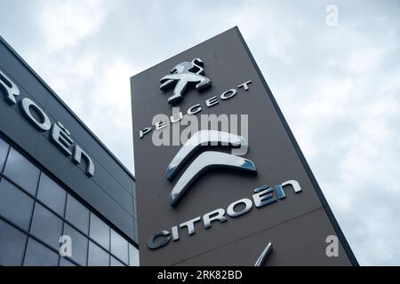 LONDON- JULY 31, 2023: Citroen and Peugeot dealer showroom in west London Stock Photo