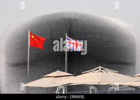 Bildnummer: 53976279  Datum: 23.04.2010  Copyright: imago/Xinhua (100426) -- SHANGHAI, April 26, 2010 (Xinhua) -- National flags of China and Britain are seen in front of the UK pavilion in the World Expo Park in Shanghai, east China, April 23, 2010. Britain has set up in the Shanghai Expo a Crystal Palace -- a dazzling cube formed by more than 60,000 slim and transparent acrylic rods containing seeds of different plants that were collected in a bio-diversity project.The pavilion, nicknamed dandelion by the Chinese public, intends to convey the idea of Building on the past, Shaping our future. Stock Photo