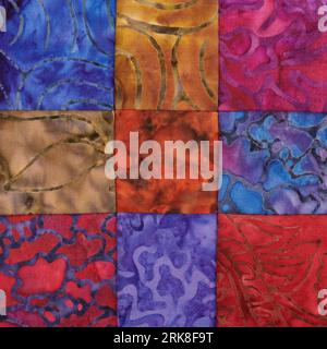 Sewn square bright pieces of batik, part of quilt, traditional patchwork Stock Photo