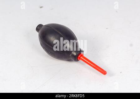 A Manual Hand Air Blower isolated on White Background, This blower is generally used to clean dust from the DSLR or Mirrorless cameras and, Lenses. Stock Photo