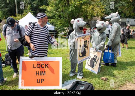 Atlanta, United States. 24th Aug, 2023. Domenic Santana, who was previously arrested in Miami after jumping in front of former president Donald Trump's motorcade, looks on as Republicans Against Trump carry rat posters outside of Fulton County jail on Thursday, August 24, 2023 in Atlanta, Georgia. Donald Trump turned himself in Thursday in Fulton County, Georgia, after he was indicted on charges stemming from his efforts to hold on to office in the wake of the 2020 election. Photo by Anthony Stalcup/UPI Credit: UPI/Alamy Live News Stock Photo