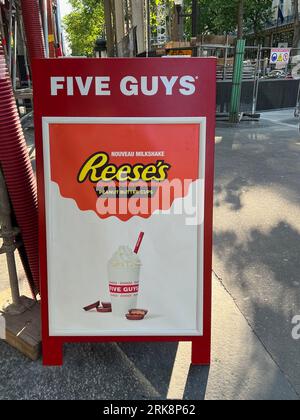 France. 15th June, 2023. A sign advertises a new milkshake made with Reese's Peanut Butter Cups at a Five Guys Restaurant in Paris on June 15, 2023. There are approximately 25 Five Guys locations in France. (Photo by Samuel Rigelhaupt/Sipa USA) Credit: Sipa USA/Alamy Live News Stock Photo