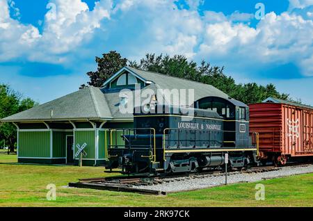 A 1941 diesel locomotive train sits outside the historic Foley Train Depot, which now houses the Foley Railroad Museum in Foley, Alabama. Stock Photo