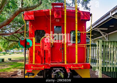 A Louisville and Nashville Railroad caboose sits outside the historic Foley Train Depot, which now houses the Foley Railroad Museum in Foley, Alabama. Stock Photo