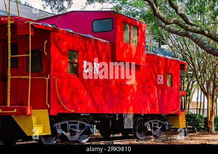 A Louisville and Nashville Railroad caboose sits outside the historic Foley Train Depot, which now houses the Foley Railroad Museum in Foley, Alabama. Stock Photo