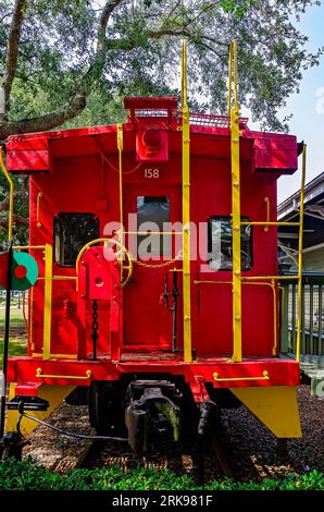 A Louisville and Nashville Railroad caboose sits outside the historic Foley Train Depot, which now houses the Foley Railroad Museum in Foley, Alabama. Stock Photo