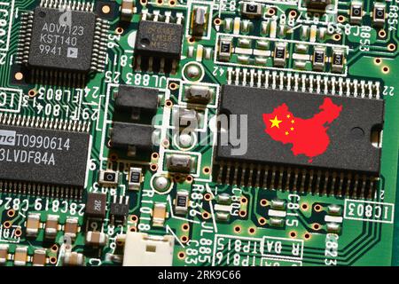 China flag on a processor, central processing unit CPU or GPU microchip on a motherboard or graphic card. Concept for the battle of global microchips Stock Photo