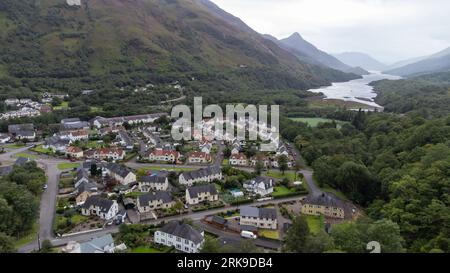 The Scottish village of Kinlochleven as seen from a drone point of view. In the background the Loch Leven (Lake Leven) can be seen, flanked by the Mam Stock Photo