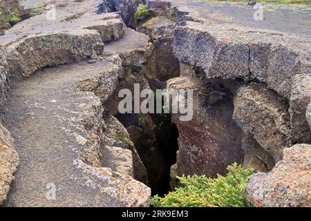 View Into Grjotagja Lava Cave With Crystal Clear Blue Water Stock Photo