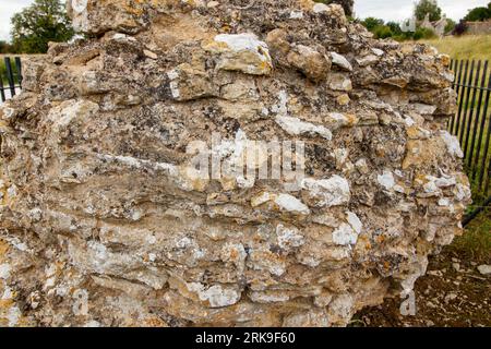 The only remaining block of masonry sitting on the site of Fotheringhay Castle which was dismantled in 1628. The historic castle was part of two major moments in English history. King Richard III was born at Fotheringhay in October 1452. Mary Queen of Scots was held prisoner and executed at Fotheringhay in February 1587. The remaining stones sit beside the River Nene in the County of Northamptonshire. Stock Photo