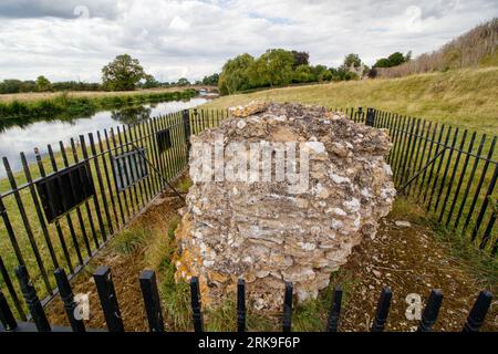 The only remaining block of masonry sitting on the site of Fotheringhay Castle which was dismantled in 1628. The historic castle was part of two major moments in English history. King Richard III was born at Fotheringhay in October 1452. Mary Queen of Scots was held prisoner and executed at Fotheringhay in February 1587. The remaining stones sit beside the River Nene in the County of Northamptonshire. Stock Photo