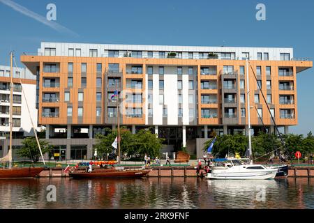 Modern residential apartment buildings by Invest Komfort at Motlawa River in the Old Town of Gdansk, Poland, Europe, EU Stock Photo