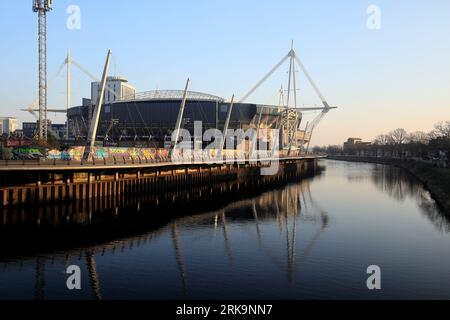 Principality rugby stadium, Cardiff, early evening light. With reflection in the River Taff.  Taken August 2023. Stock Photo