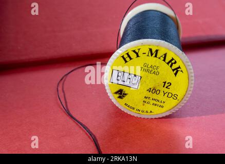 Cotton glace thread offers excellent frictional characteristics for sewing, USA Stock Photo