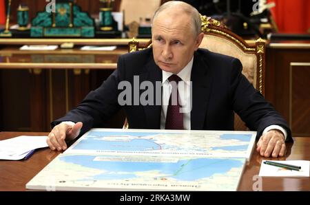 Moscow, Russia. 24th Aug, 2023. Russian President Vladimir Putin listens to acting governor of the Kherson region Vladimir Saldo during a face-to-face meeting at the Kremlin, August 24, 2023 in Moscow, Russia. Credit: Mikhail Klimentyev/Kremlin Pool/Alamy Live News Stock Photo