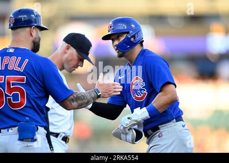 The Chicago Cubs' Seiya Suzuki (R) is congratulated by first base coach  Mike Napoli after hitting an RBI single in the fourth inning of a baseball  game against the Pittsburgh Pirates on