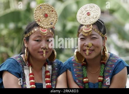 Bildnummer: 54285477  Datum: 09.08.2010  Copyright: imago/Xinhua (100809) -- KATHMANDU, Aug. 9, 2010 (Xinhua) -- Nepalese women from Limbu community wearing their traditional outfits and ornaments look on during the World Indigenous Day rally in Kathmandu, capital of Nepal, Aug. 9, 2010. Some ethnic and indigenous of Nepal took part in the rally on Monday to call for the preservation of their culture and identity. (Xinhua/Bimal Gutam)(zl) NEPAL-WORLD INDIGENOUS DAY PUBLICATIONxNOTxINxCHN Gesellschaft kbdig xkg 2010 quer Aufmacher premiumd xint o0 Internationaler Tag der einheimischen Bevölkeru Stock Photo