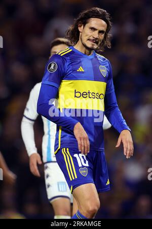 Edinson Cavani of Argentina's Boca Juniors heads the ball during a Copa  Libertadores quarterfinal second leg soccer match against Argentina's  Racing Club at Presidente Peron stadium in Buenos Aires, Argentina,  Wednesday, Aug.