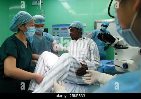 Bildnummer: 54474925  Datum: 25.09.2010  Copyright: imago/Xinhua (100927) -- DJIBOUTI, Sept. 27, 2010 (Xinhua) -- A 53-year-old Djibouti man gets up after receiving a cataract surgery aboard the Chinese navy hospital ship Peace Ark in Djibouti Sept. 25, 2010. The hospital ship, which arrived in Djibouti on Sept. 22, has provided medical services for over 1,500 by Sept. 26. (Xinhua/Zha Chunming) DJIBOUTI-CHINA-HOSPITAL SHIP-PEACE ARK-CATARACT SURGERY PUBLICATIONxNOTxINxCHN Gesellschaft Medizin Gesundheit Militär Schiff Militärkrankenhaus kbdig xub 2010 quer o0 medizinische Versorgung, Operation Stock Photo