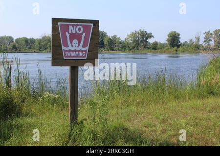 Vintage no swimming sign at Sand Pond in Illinois Beach State Park in Zion Stock Photo