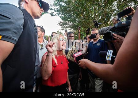 Atlanta, United States. 24th Aug, 2023. United States Representative Marjorie Taylor Greene (Republican of Georgia) talks to the press as she awaits the arrival of former US President Donald Trump with supporters, opponents and the media at the Fulton County Jail in Atlanta, GA, USA on August 24, 2023.Photo by Carlos Escalona/CNP/ABACAPRESS.COM Credit: Abaca Press/Alamy Live News Stock Photo