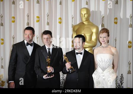 Bildnummer: 54961525  Datum: 27.02.2011  Copyright: imago/Xinhua 3(110228) -- HOLLYWOOD, Feb. 28, 2011 (Xinhua) -- Trent Reznor (2nd R) and Atticus Ross (2nd L) pose with Hugh Jackman (1st L) and Nicole Kidman after winning the best Original Score of the 83rd Annual Academy Awards for their work in the film The Social Network at the Kodak Theater in Hollywood, California, the United States, Feb. 27, 2011. (Xinhua/Qi Heng) (cl) U.S.-HOLLYWOOD-OSCARS-WINNERS PUBLICATIONxNOTxINxCHN Entertainment People Film Oscar Verleihung Oscarverleihung Los Angeles Preisträger kbdig xkg 2011 quer Aufmacher pre Stock Photo