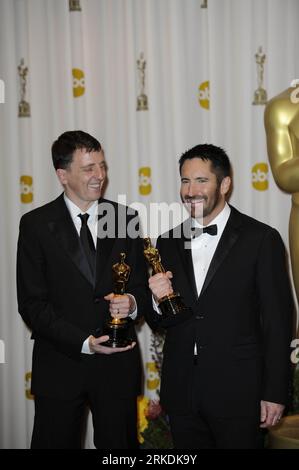 Bildnummer: 54961530  Datum: 27.02.2011  Copyright: imago/Xinhua (110227) -- HOLLYWOOD, Feb. 27, 2011 (Xinhua) -- Trent Reznor (R) and Atticus Ross pose with trophyies after winning the best Original Score of the 83rd Annual Academy Awards for their work in the film The Social Network at the Kodak Theater in Hollywood, California, the United States, Feb. 27, 2011. (Xinhua/Qi Heng) (cl) U.S.-HOLLYWOOD-OSCARS-WINNERS PUBLICATIONxNOTxINxCHN Entertainment People Film Oscar Verleihung Oscarverleihung Los Angeles Preisträger kbdig xkg 2011 hoch Aufmacher premiumd o0 Bester Soundtrack    Bildnummer 5 Stock Photo