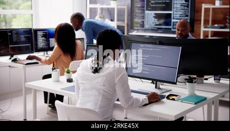 African Business Team Working On Computer. Software App Development Stock Photo