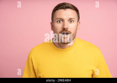 Surprised astonished expression on man face. Surprise, amazement, wonderment, shock, good news Stock Photo