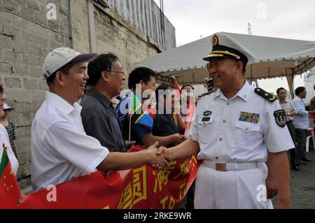 Bildnummer: 55155931  Datum: 30.03.2011  Copyright: imago/Xinhua (110330) -- DAR ES SALAAM, March 30, 2011 (Xinhua) -- Task Force Commander Rear Admiral Zhang Huachen (R) shakes hands with Chen Zhufeng, head of Chinese medical team to Tanzania during a send-off ceremony for the Chinese People s Liberation Army (PLA) Navy Seventh Escort Task Force in Dar Es Salaam, Tanzania, March 30, 2011. Two Chinese navy missile frigates left Dar es Salaam on Wednesday after ending a 5-day goodwill visit to Tanzania with the aim to boost friendly exchanges and deepen bilateral friendship. (Xinhua/Guo Chunju) Stock Photo