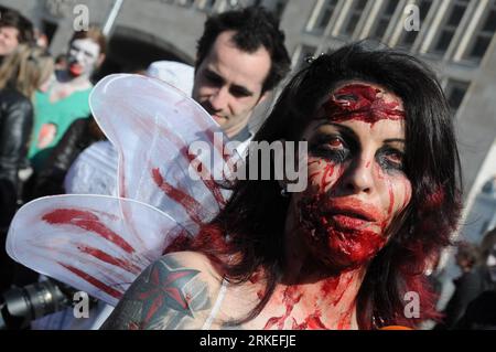 Bildnummer: 55249375  Datum: 09.04.2011  Copyright: imago/Xinhua (110409) -- BRUSSELS, April 9, 2011 (Xinhua) -- A woman dressed as zombie reacts during a zombie parade in Brussels, capital of Belgium on April 9, 2011. More than a hundred dressed as zombies took part in the parade Saturday, which is a part of activities during the annual Brussels Fantastic Film Festival. (Xinhua/Wu Wei) (zw) BELGIUM-ZOMBIE-PARADE PUBLICATIONxNOTxINxCHN Gesellschaft Zombies Zombieparade Kostüm premiumd kbdig xng 2011 quer     Bildnummer 55249375 Date 09 04 2011 Copyright Imago XINHUA  Brussels April 9 2011 XINH Stock Photo