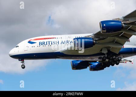 British Airways Airbus A380 jet airliner plane G-XLEC on finals to land at London Heathrow Airport, UK. Wide body super jumbo with wheels down Stock Photo