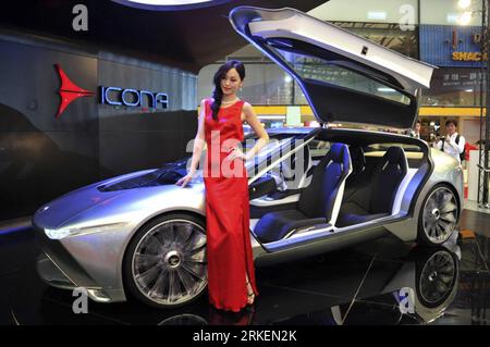 Bildnummer: 55277537  Datum: 20.04.2011  Copyright: imago/Xinhua (110420) -- SHANGHAI, April 20, 2011 (Xinhua) -- A showgirl poses by an electric concept sports car designed by Icona during the preview of the 14th Shanghai International Automobile Industry Exhibition in east China s Shanghai, April 20, 2011. The 14th Shanghai International Automobile Industry Exhibition will be open to the public from April 21 to 28. About 2,000 carmakers and parts providers from 20 countries are due to showcase 1,100 car models, 75 of which makes their world premieres in the auto show. (Xinhua/Zheng Xianzhang Stock Photo