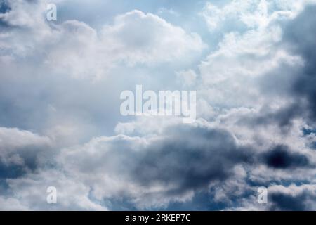 Dark thunderclouds over gray horizon. Storm-cloud heavy gale black stormy clouds Stock Photo